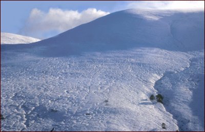 {snow covered hill in Allt a' Mharcaidh catchment}
