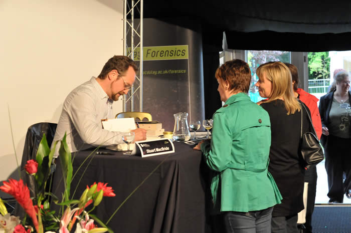 Stuart MacBride signing copies of his books