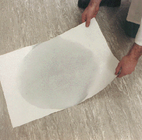 The spray dried sample is deposited on a sheet of paper