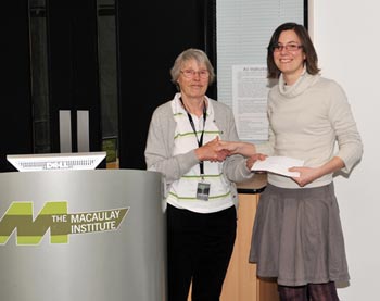 Heather Smith receiving her prize from Professor Janet Sprent